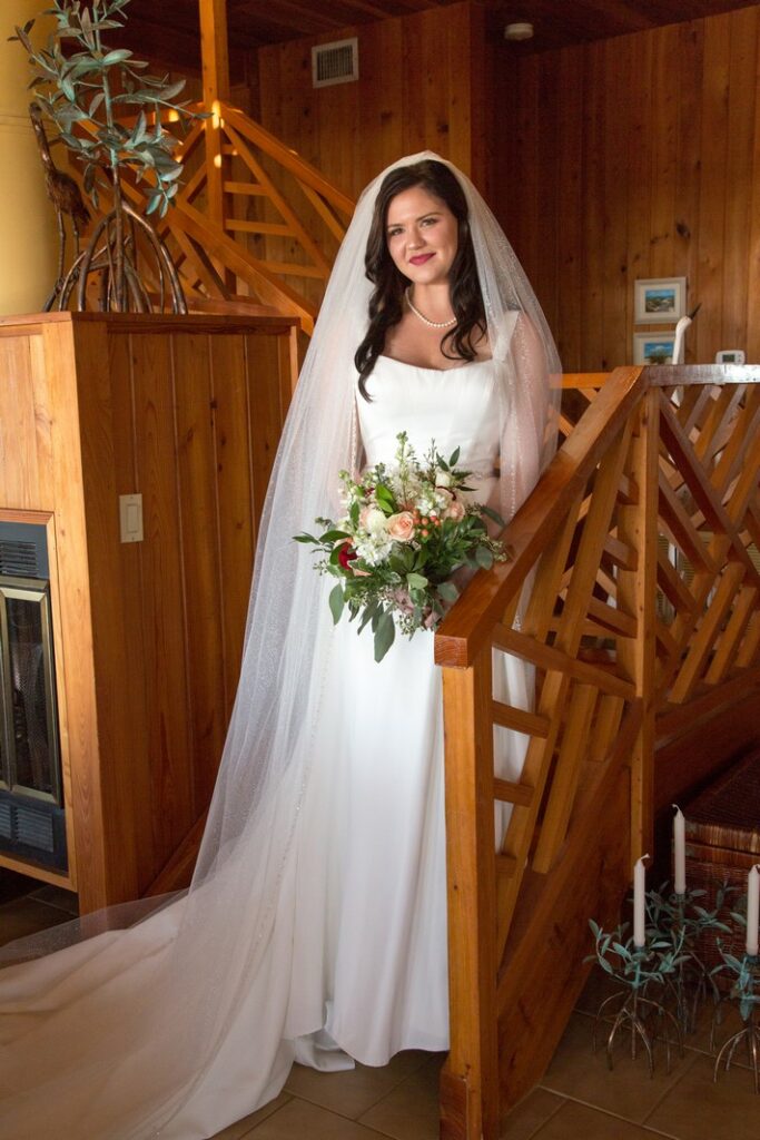 beautiful young bride standing on a staircase