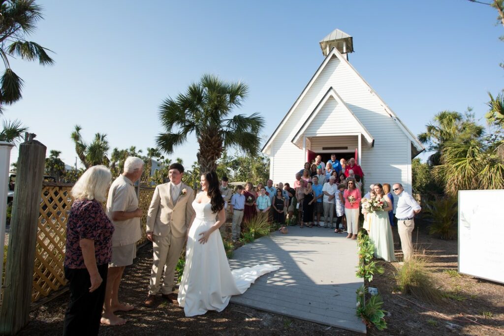 wedding guests leaving the Amory Chapel in Boca Grande, FL