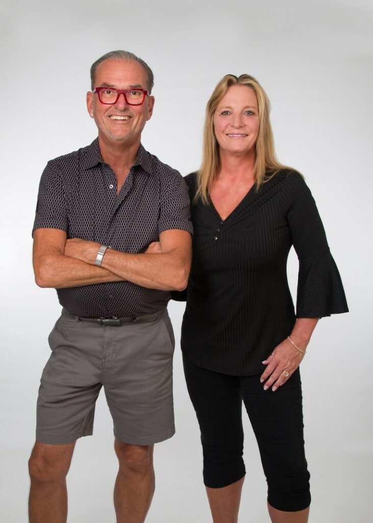 studio portrait of male and female business partners