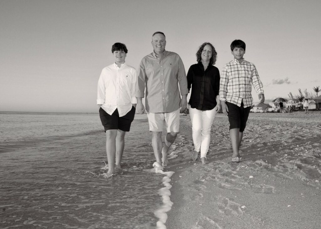 family portrait - walking on the beach - in black and white